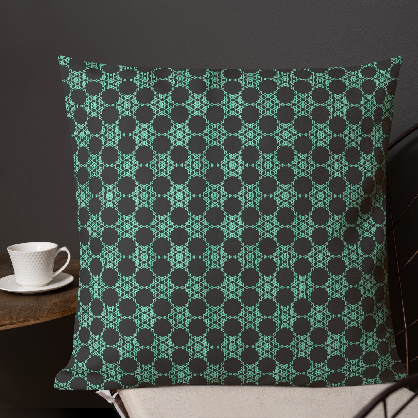 22″×22″ premium throw pillow with the 'Flowers Victory' charcoal and mint geometric pattern shown in a lifestyle setting.