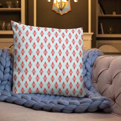 22″×22″ premium throw pillow with the 'Digon' sky blue and red geometric pattern shown in a lifestyle setting.