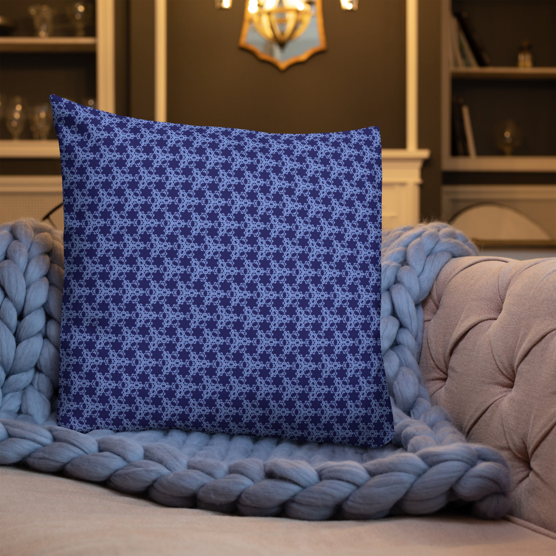 22″×22″ premium throw pillow with the 'Trigon' navy and blue geometric pattern shown in a lifestyle setting.