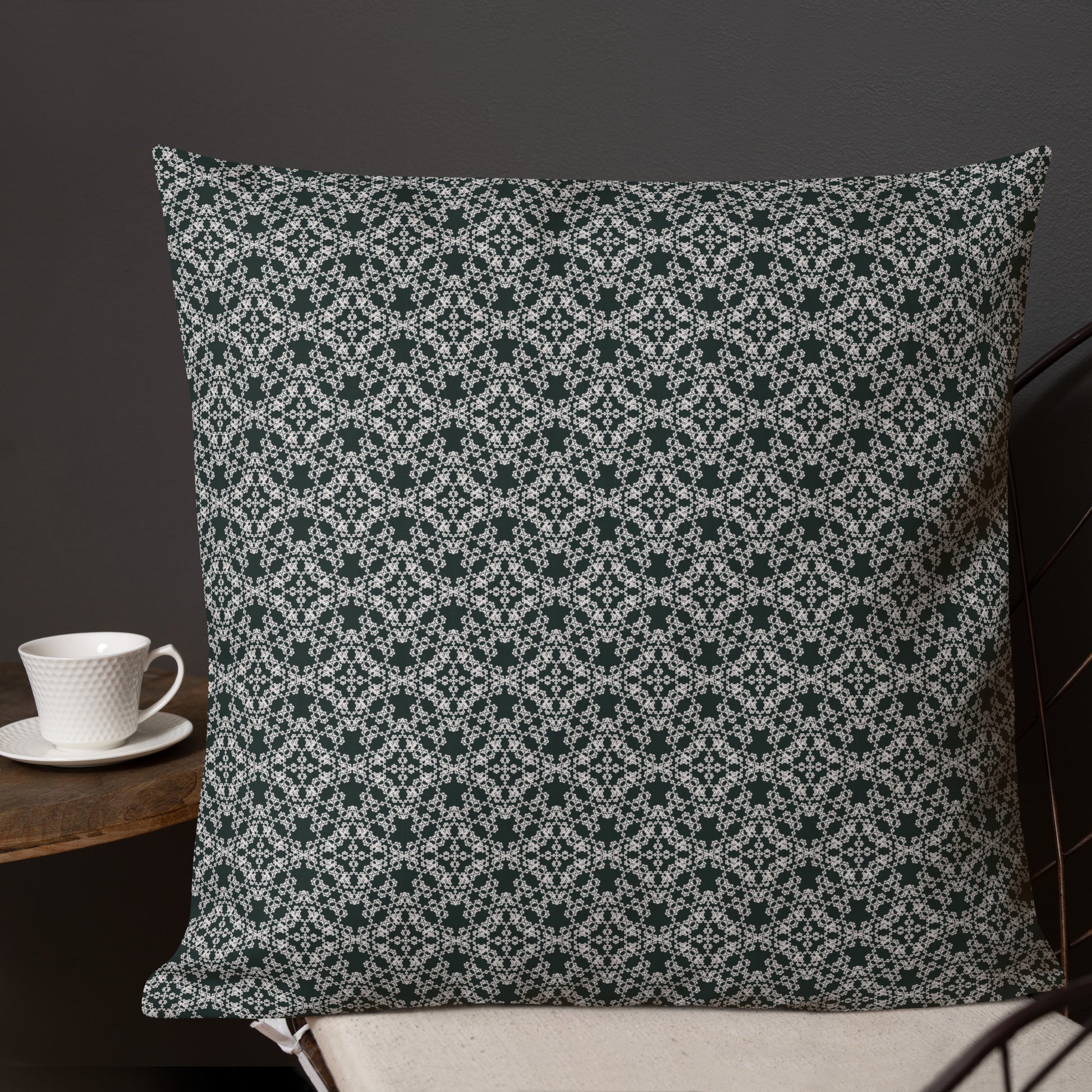22″×22″ premium throw pillow with the 'Tetragon' charcoal and white geometric pattern shown in a lifestyle setting.