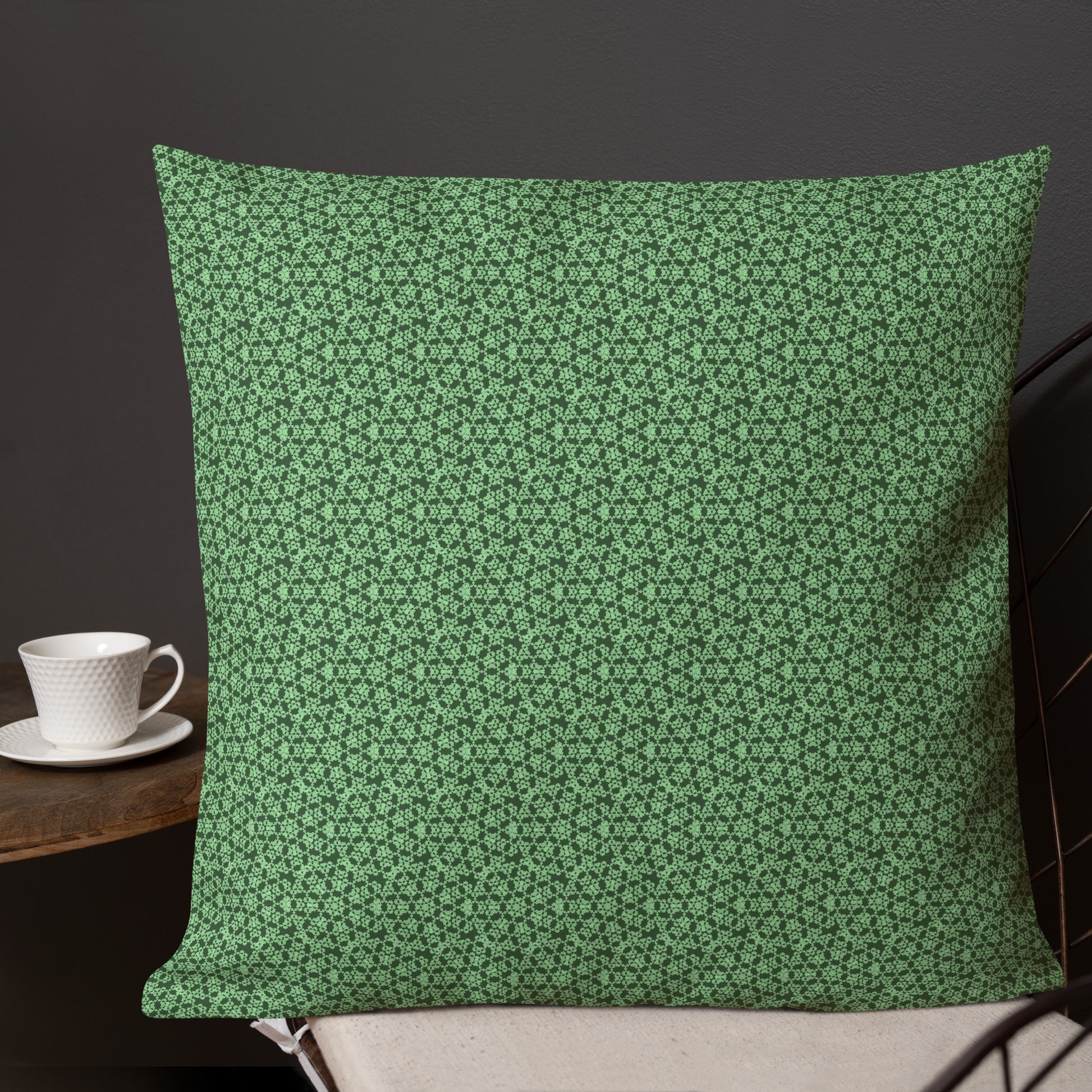 22″×22″ premium throw pillow with the 'Heptagon' green geometric pattern shown in a lifestyle setting.