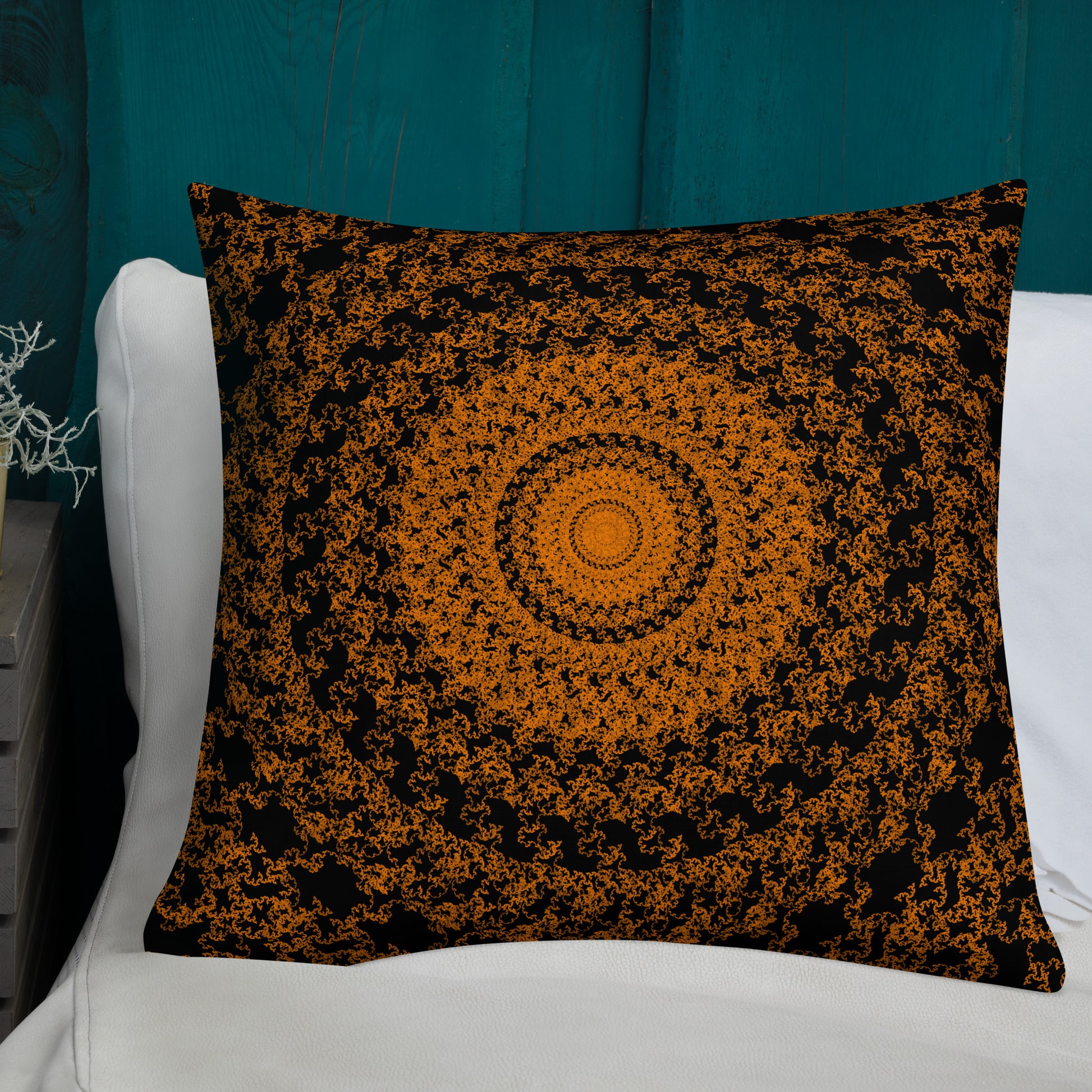 22″×22″ premium throw pillow with the 'The Sun' orange and black geometric design shown in a lifestyle setting.