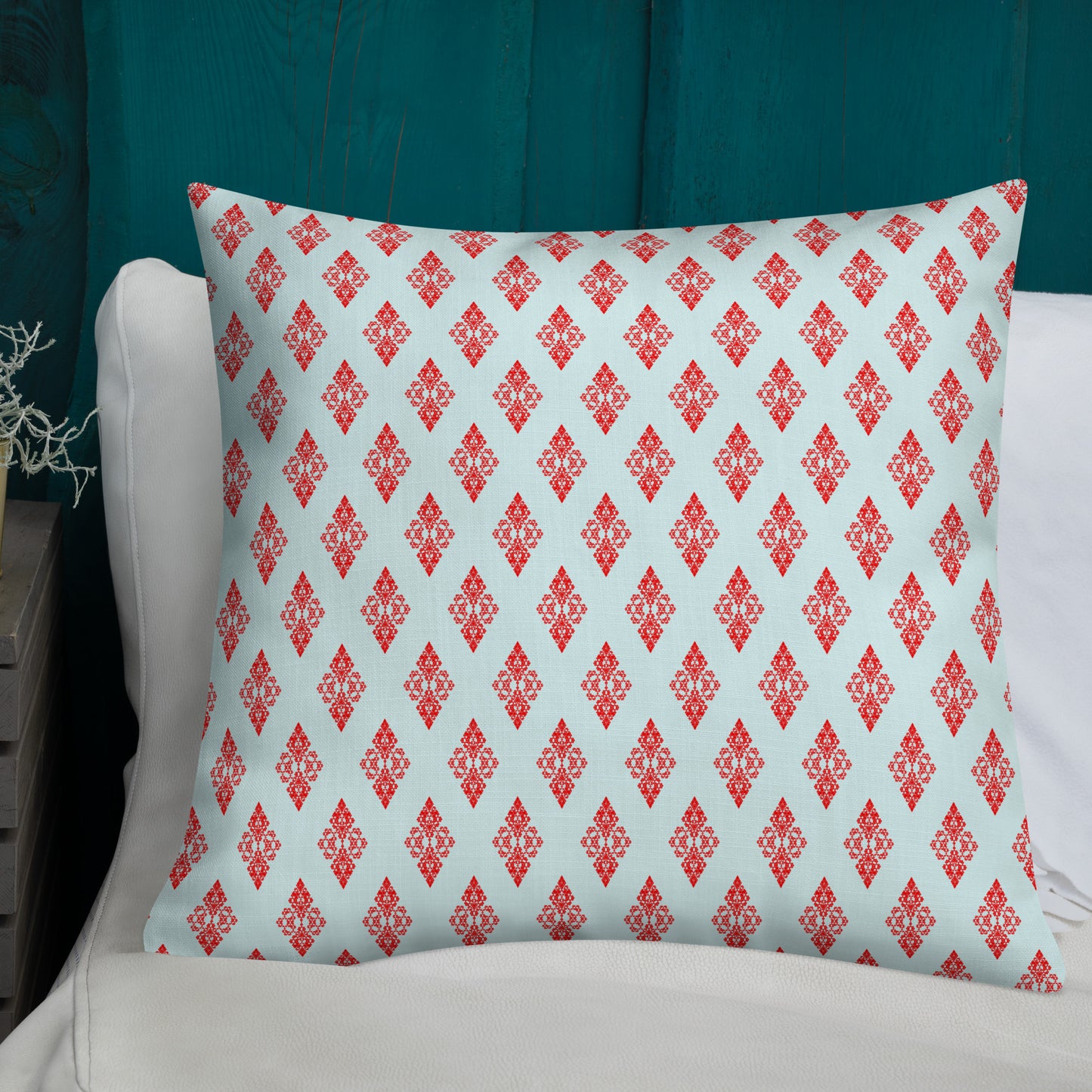 22″×22″ premium throw pillow with the 'Digon' sky blue and red geometric pattern shown in a lifestyle setting.