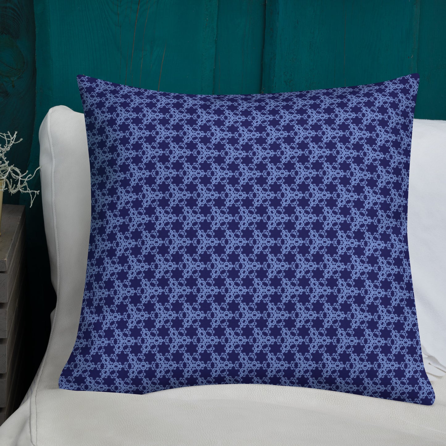 22″×22″ premium throw pillow with the 'Trigon' navy and blue geometric pattern shown in a lifestyle setting.