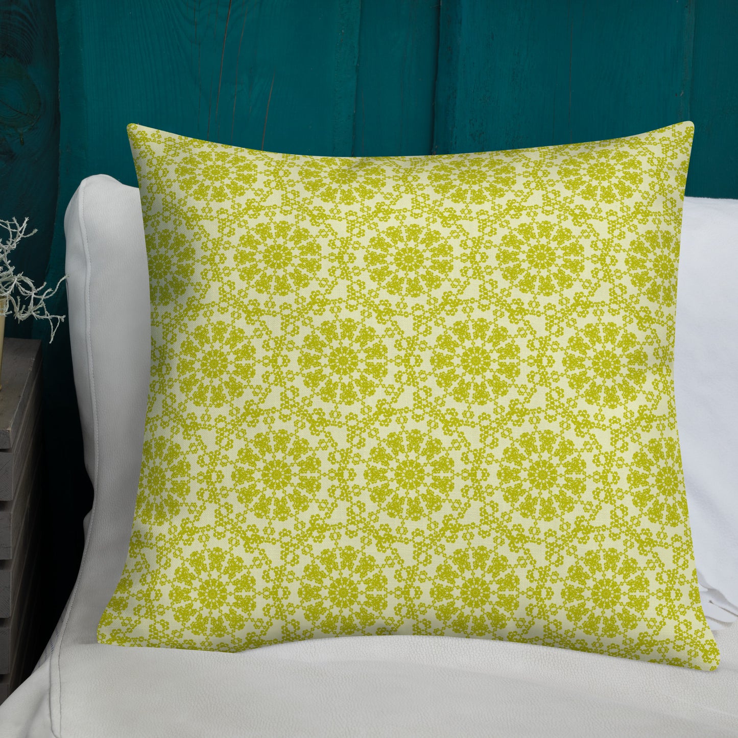 22″×22″ premium throw pillow with the 'Hendecagon' yellow-green geometric pattern on a bed with teal headboard