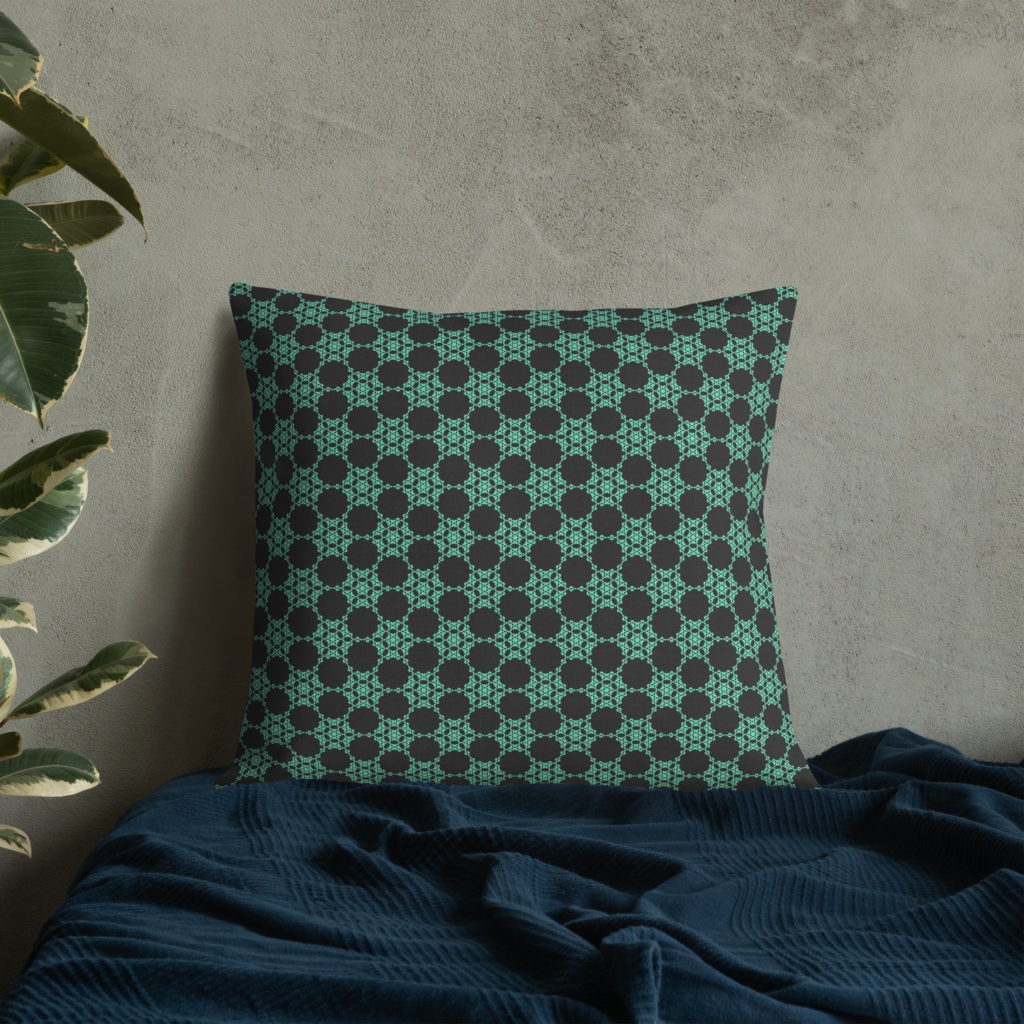 22″×22″ premium throw pillow with the 'Flowers Victory' charcoal and mint geometric pattern on a bed.