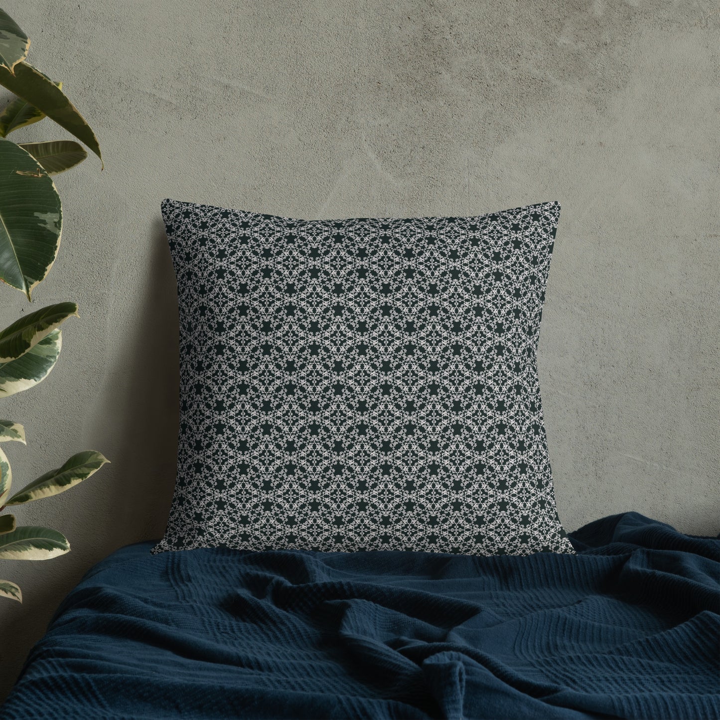 22″×22″ premium throw pillow with the 'Tetragon' charcoal and white geometric pattern on a bed.