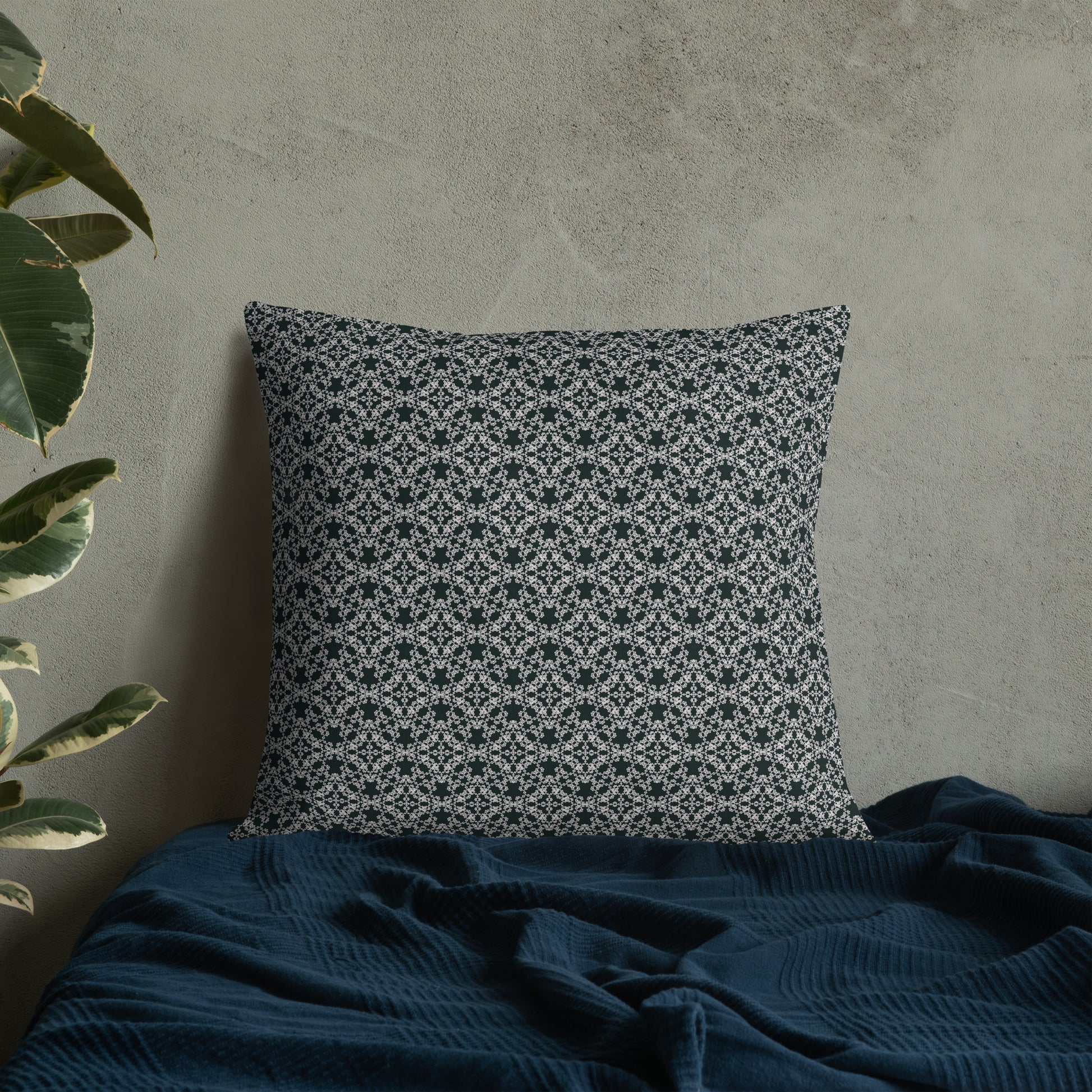 22″×22″ premium throw pillow with the 'Tetragon' charcoal and white geometric pattern on a bed.