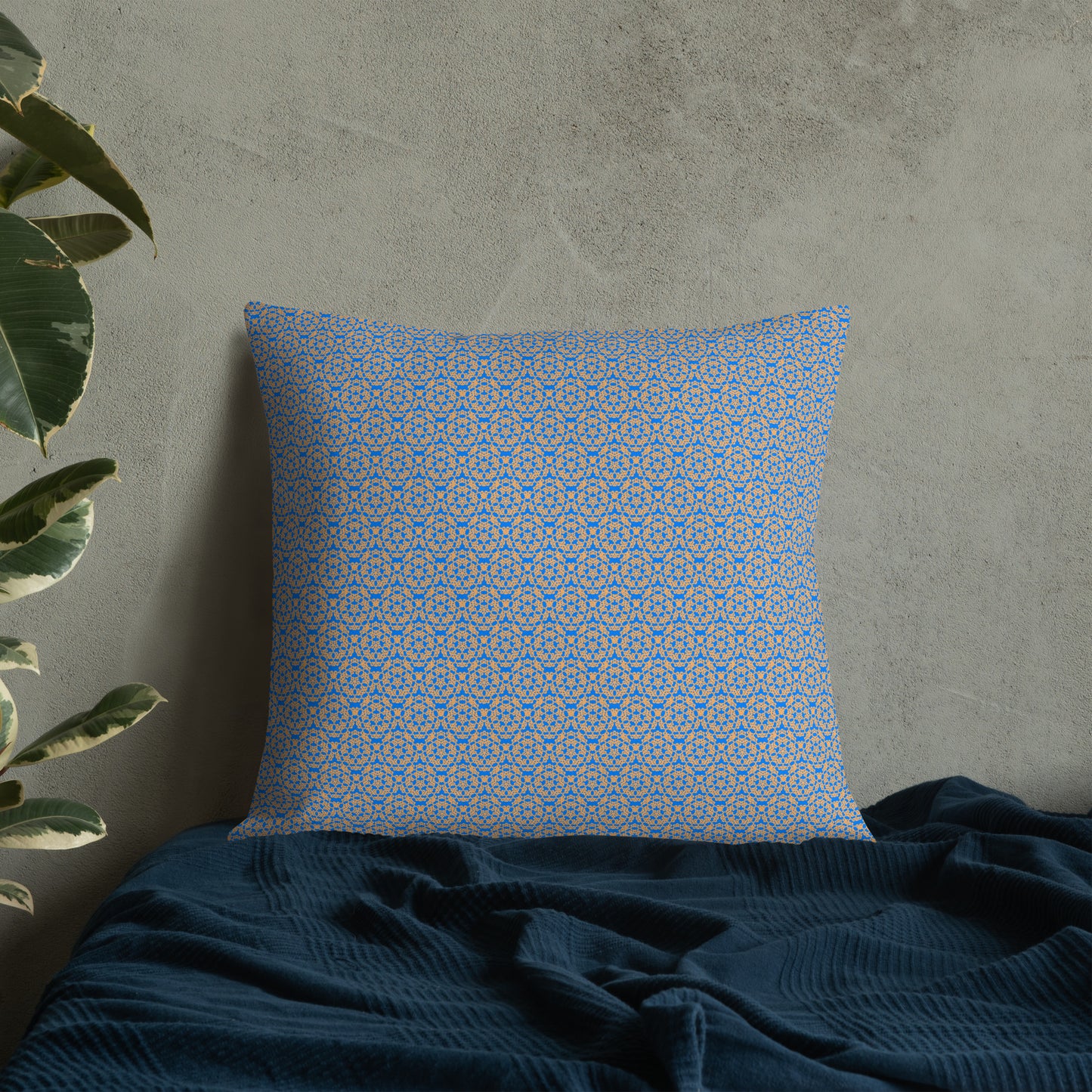 22″×22″ premium throw pillow with the 'Pentagon' blue and yellow geometric pattern on a bed.