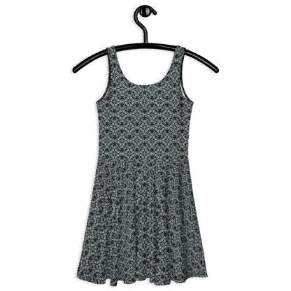 Back of the hung skater dress with the 'Quadragon' charcoal and white fractal geometric pattern.