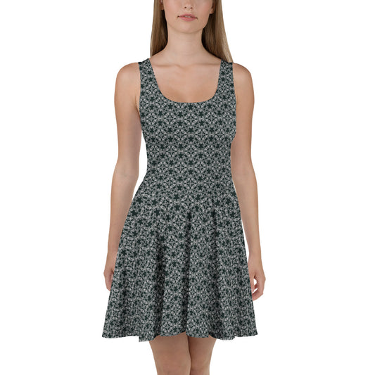 Front shot of a model wearing the skater dress with the 'Quadragon' charcoal and white fractal geometric pattern.