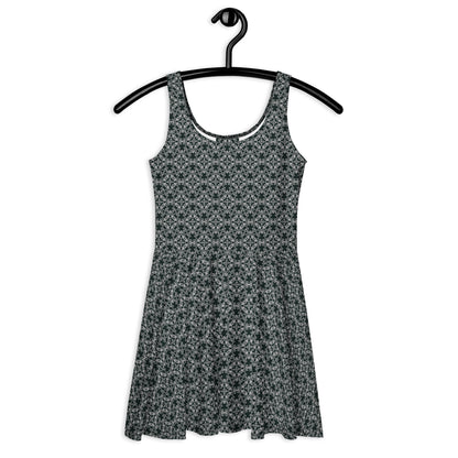 Front of the hung skater dress with the 'Quadragon' charcoal and white fractal geometric pattern.
