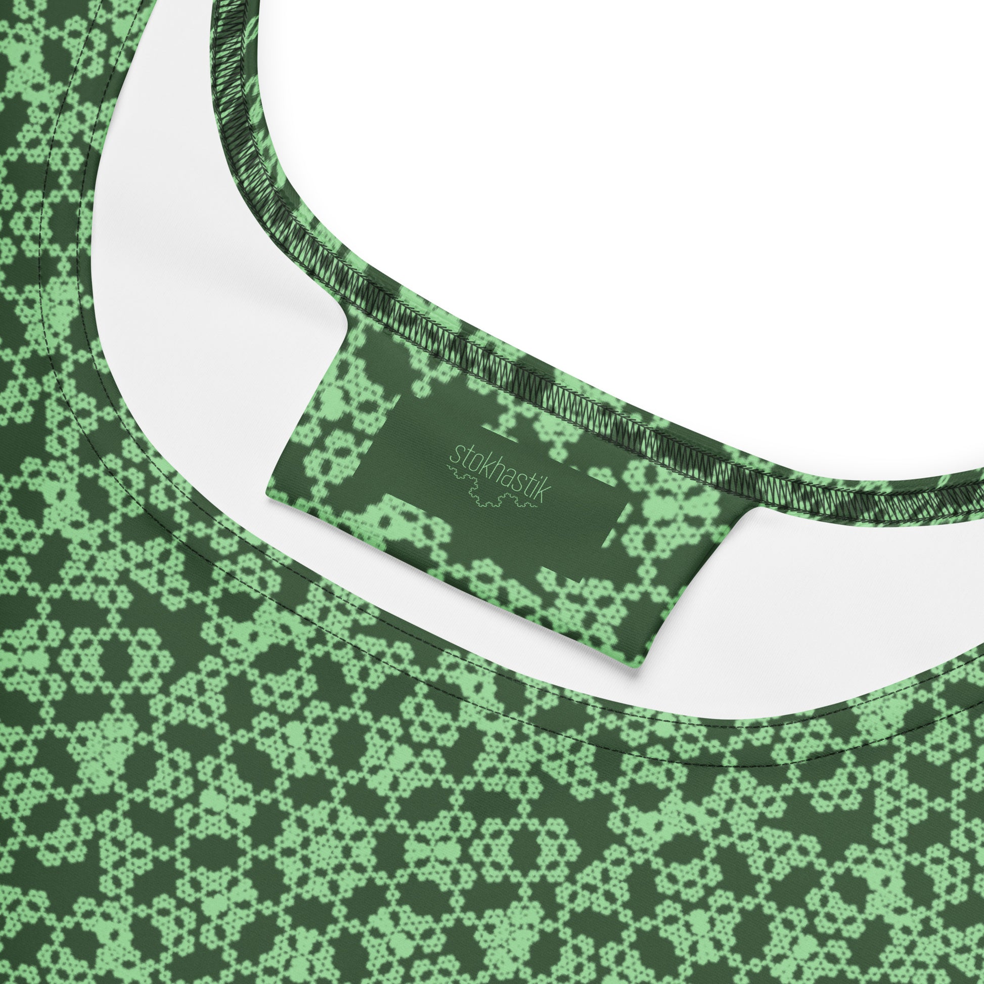 Inside label of the skater dress with the 'Heptagon' green fractal geometric pattern.