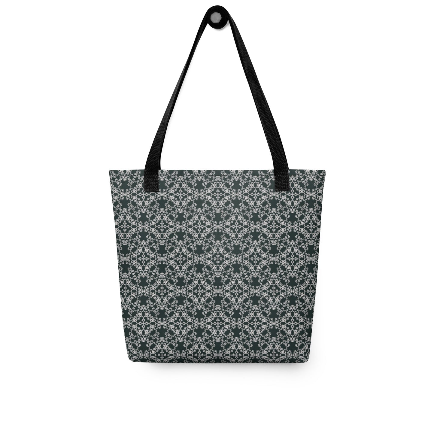 Hung tote bag with the 'Quadragon' charcoal and white fractal geometric pattern.