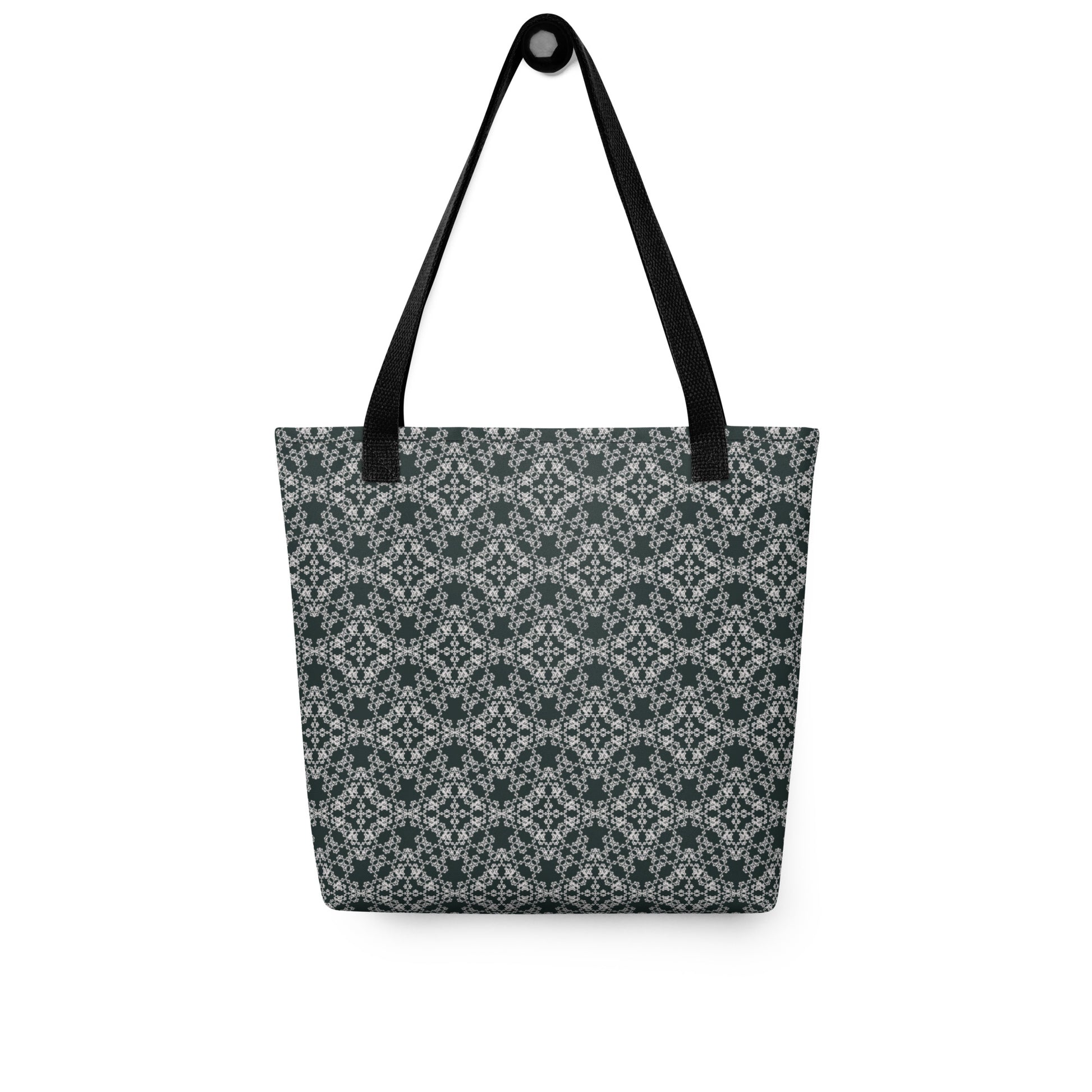 Hung tote bag with the 'Quadragon' charcoal and white fractal geometric pattern.