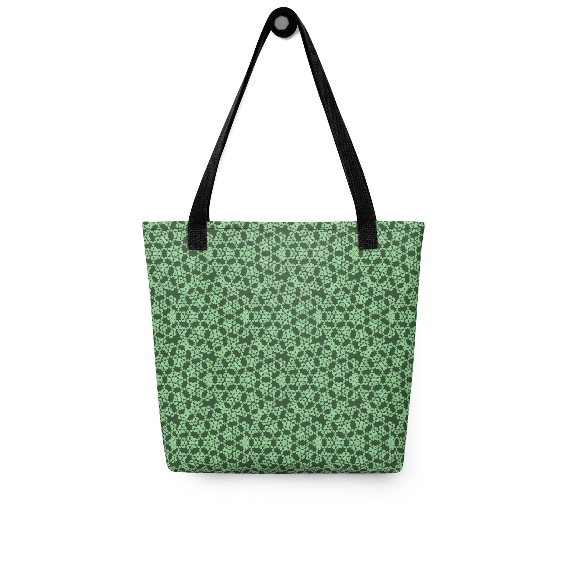 Hung tote bag with the 'Heptagon' green fractal geometric pattern.