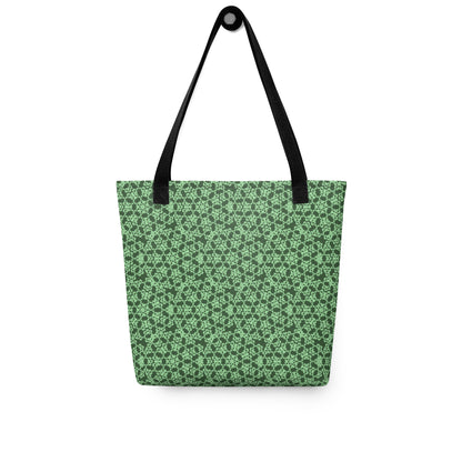 Hung tote bag with the 'Heptagon' green fractal geometric pattern.