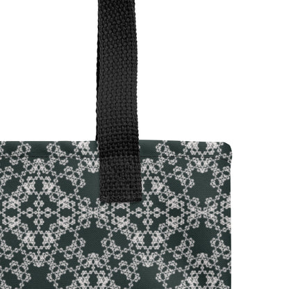 Close up of the strap stitching of the tote bag with the 'Quadragon' charcoal and white fractal geometric pattern.
