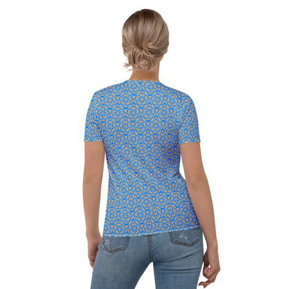 Back shot of a young woman wearing women's t-shirt with the 'Pentagon' blue and yellow fractal geometric pattern.