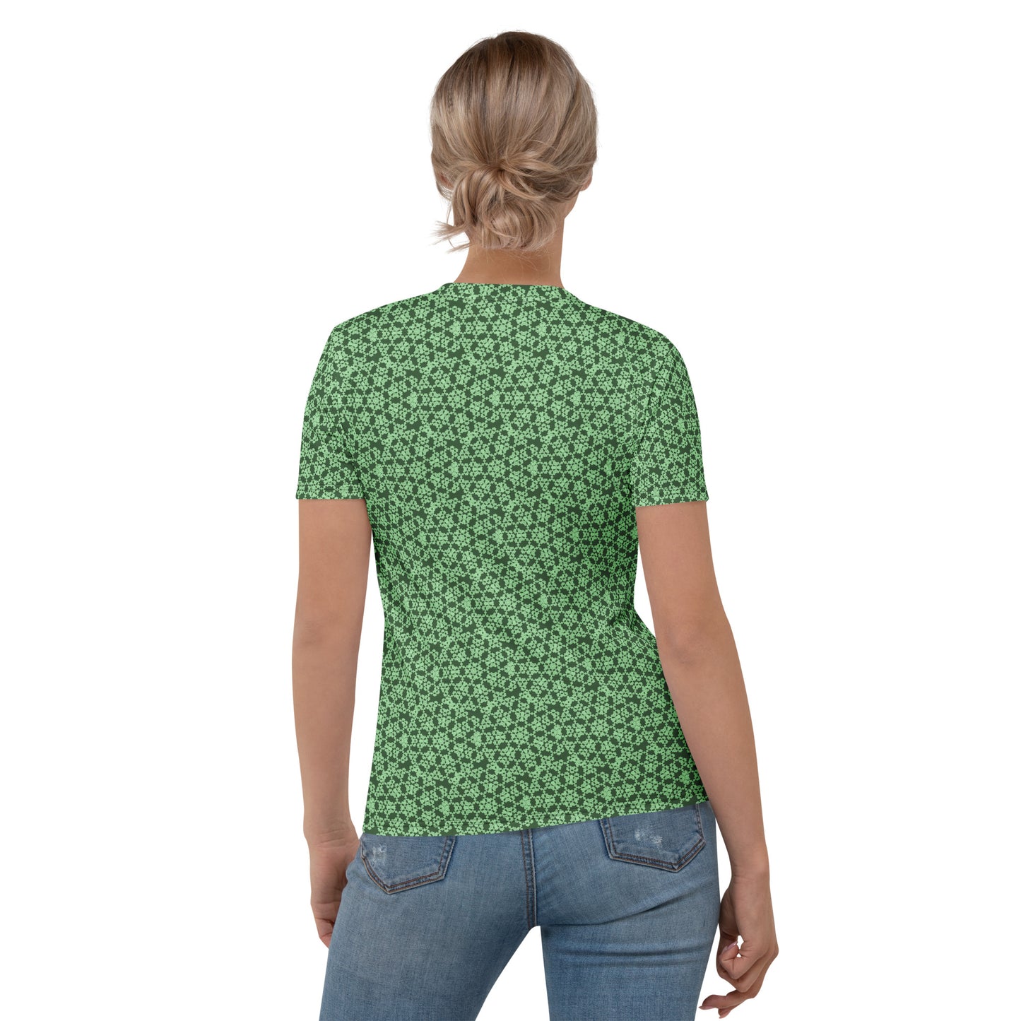 Back shot of a young woman wearing women's t-shirt with the 'Heptagon' green fractal geometric pattern.