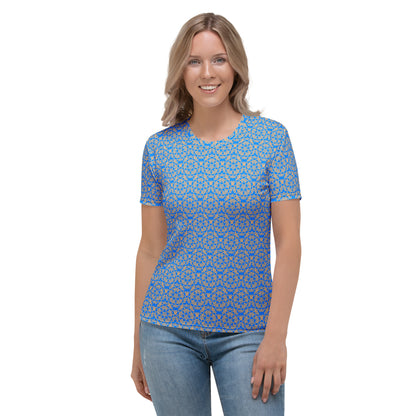 Front shot of a young woman wearing women's t-shirt with the 'Pentagon' blue and yellow fractal geometric pattern.
