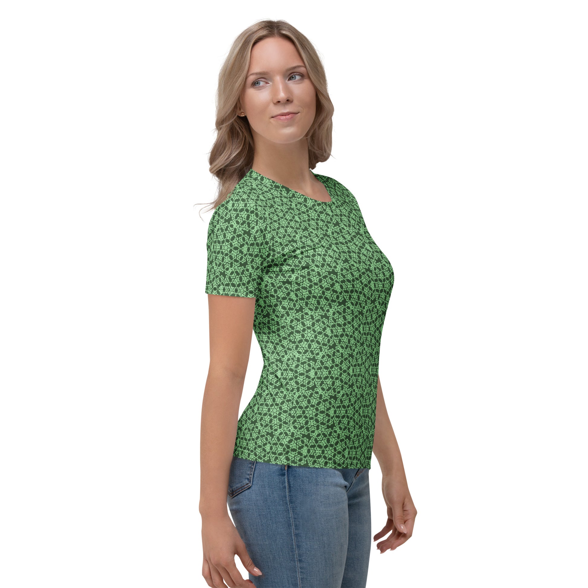Right angle shot of a young woman wearing women's t-shirt with the 'Heptagon' green fractal geometric pattern.