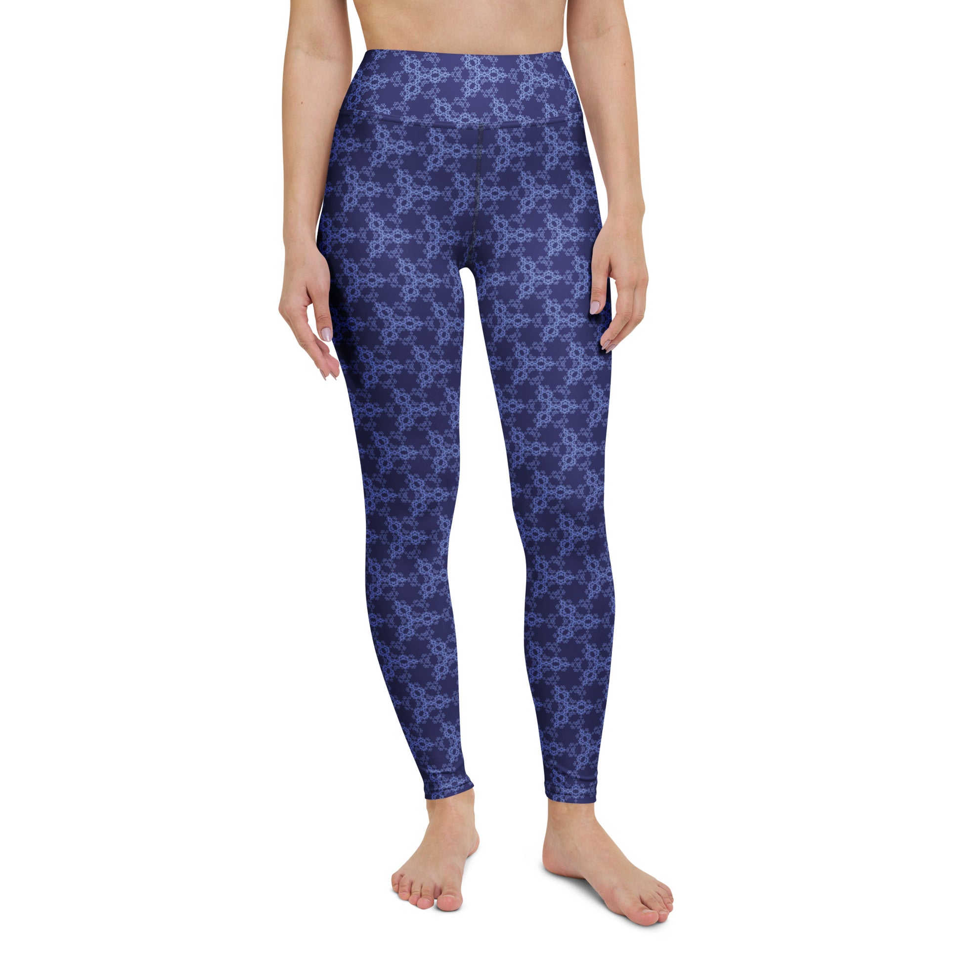 Front close-up of the lower legs of a model wearing leggings with the 'Triagon' navy and blue fractal geometric pattern.