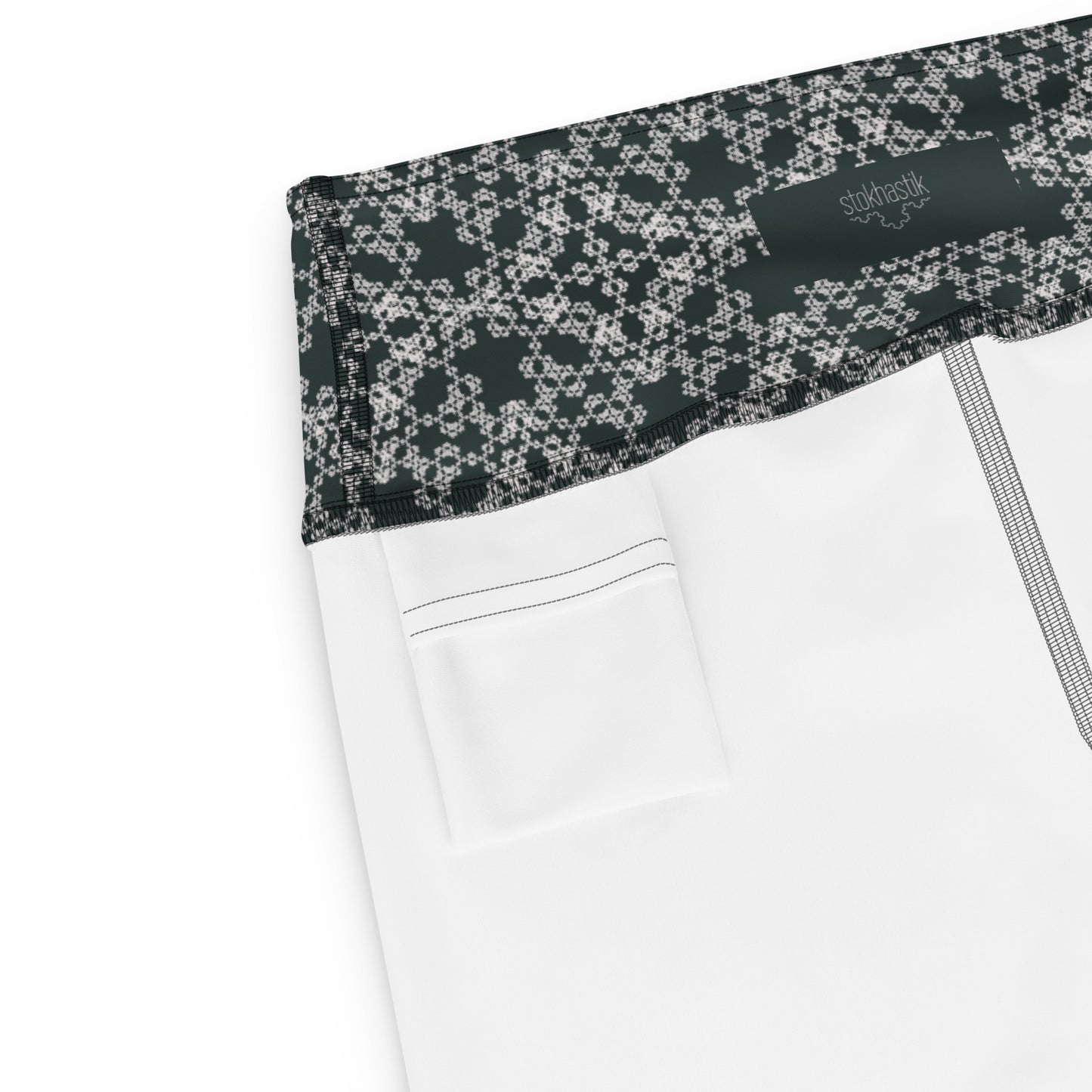 Inside pocket of leggings with the 'Quadragon' charcoal and white fractal geometric pattern.