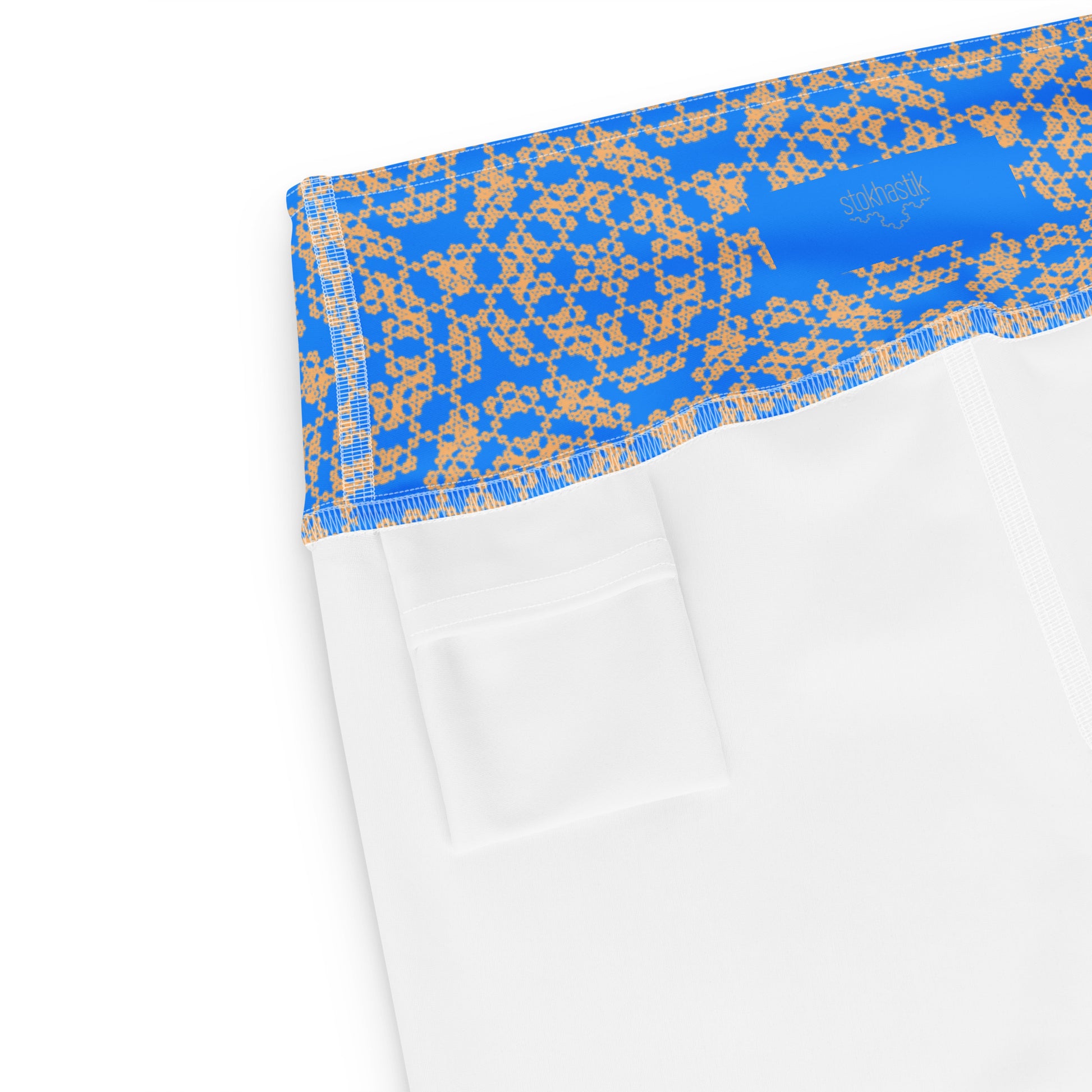 Inside pocket of leggings with the 'Pentagon' blue and yellow fractal geometric pattern.