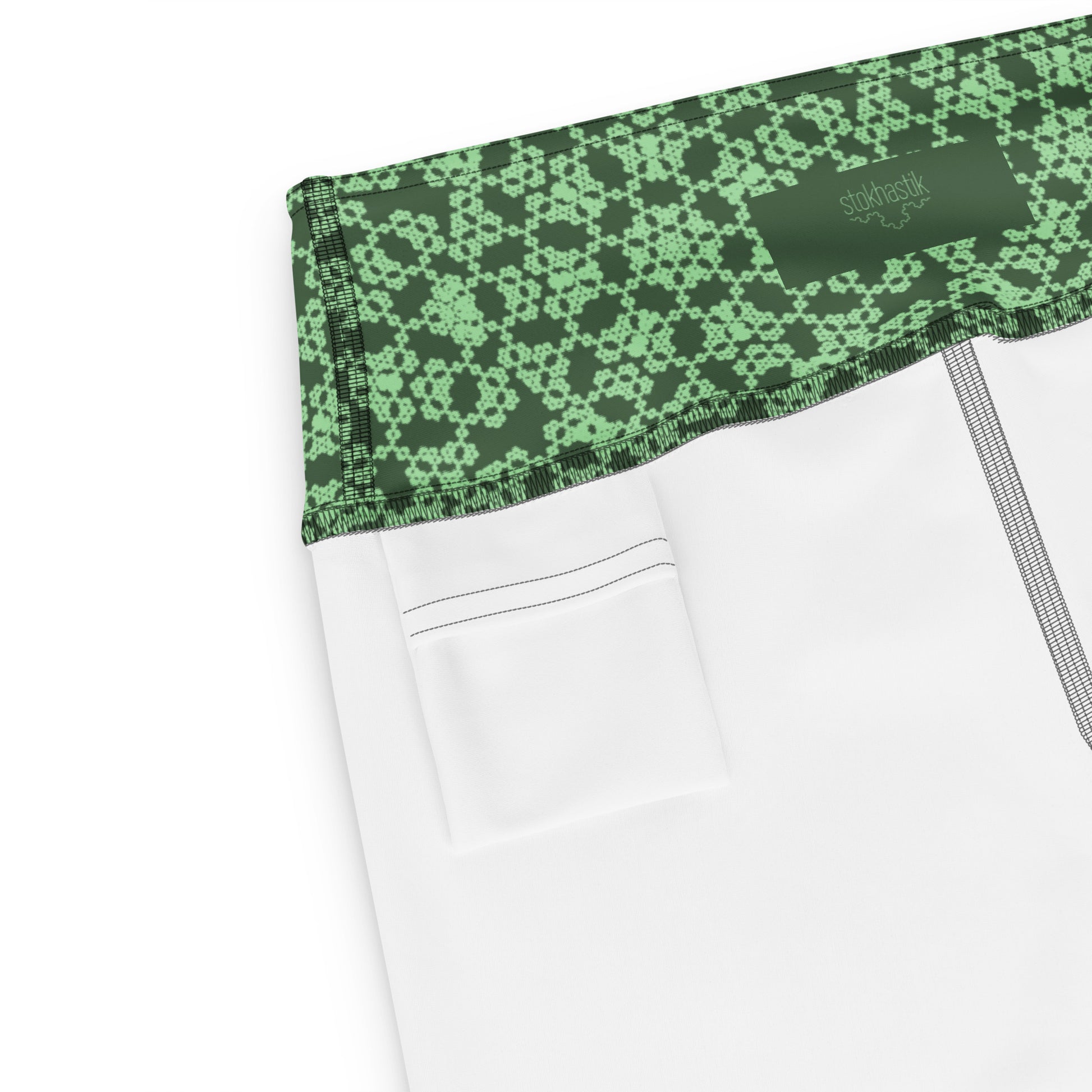 Inside pocket of leggings with the 'Heptagon' green fractal geometric pattern.