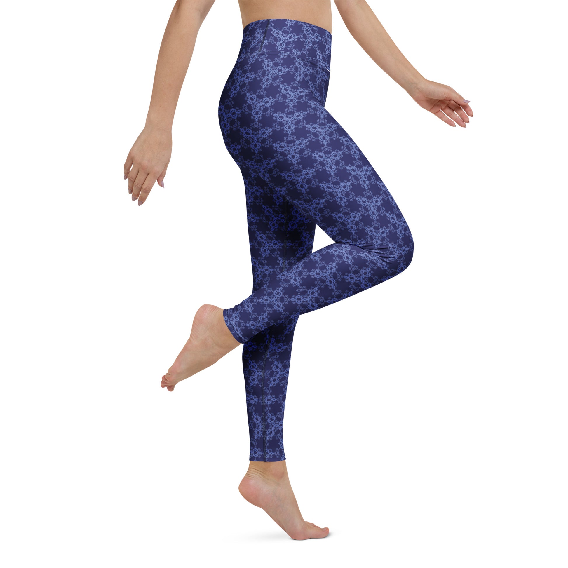 Right close-up of the lower legs of a model wearing leggings with the 'Triagon' navy and blue fractal geometric pattern.