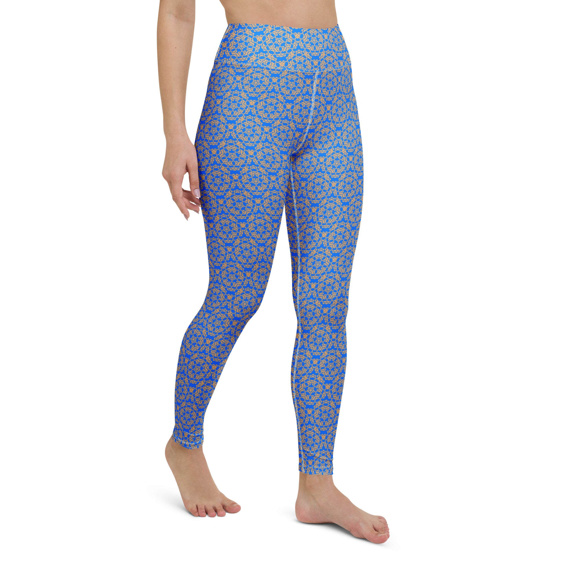 Right-front close-up of the legs of a model wearing leggings with the 'Pentagon' blue and yellow fractal geometric pattern.