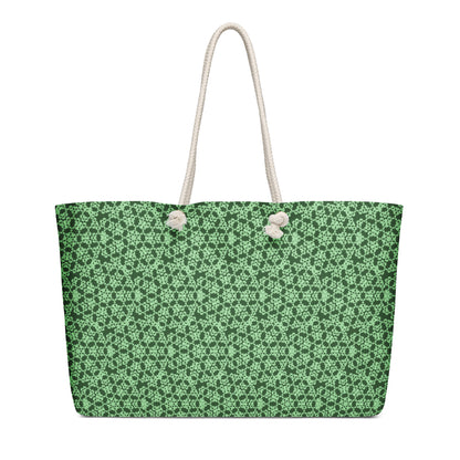 Right angle shot of the oversized weekender bag with the 'Heptagon' green fractal geometric pattern.