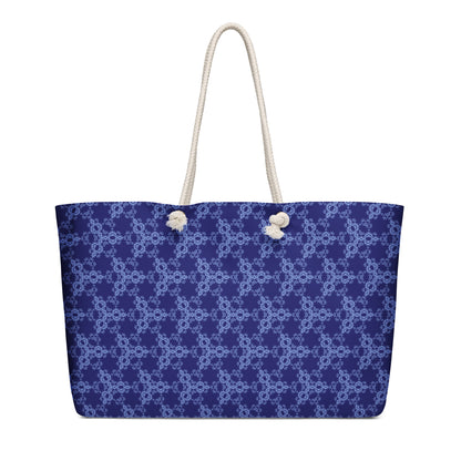 Oversized weekender bag with the 'Triagon' navy and blue fractal geometric pattern.