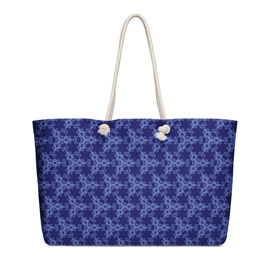 Oversized weekender bag with the 'Triagon' navy and blue fractal geometric pattern.