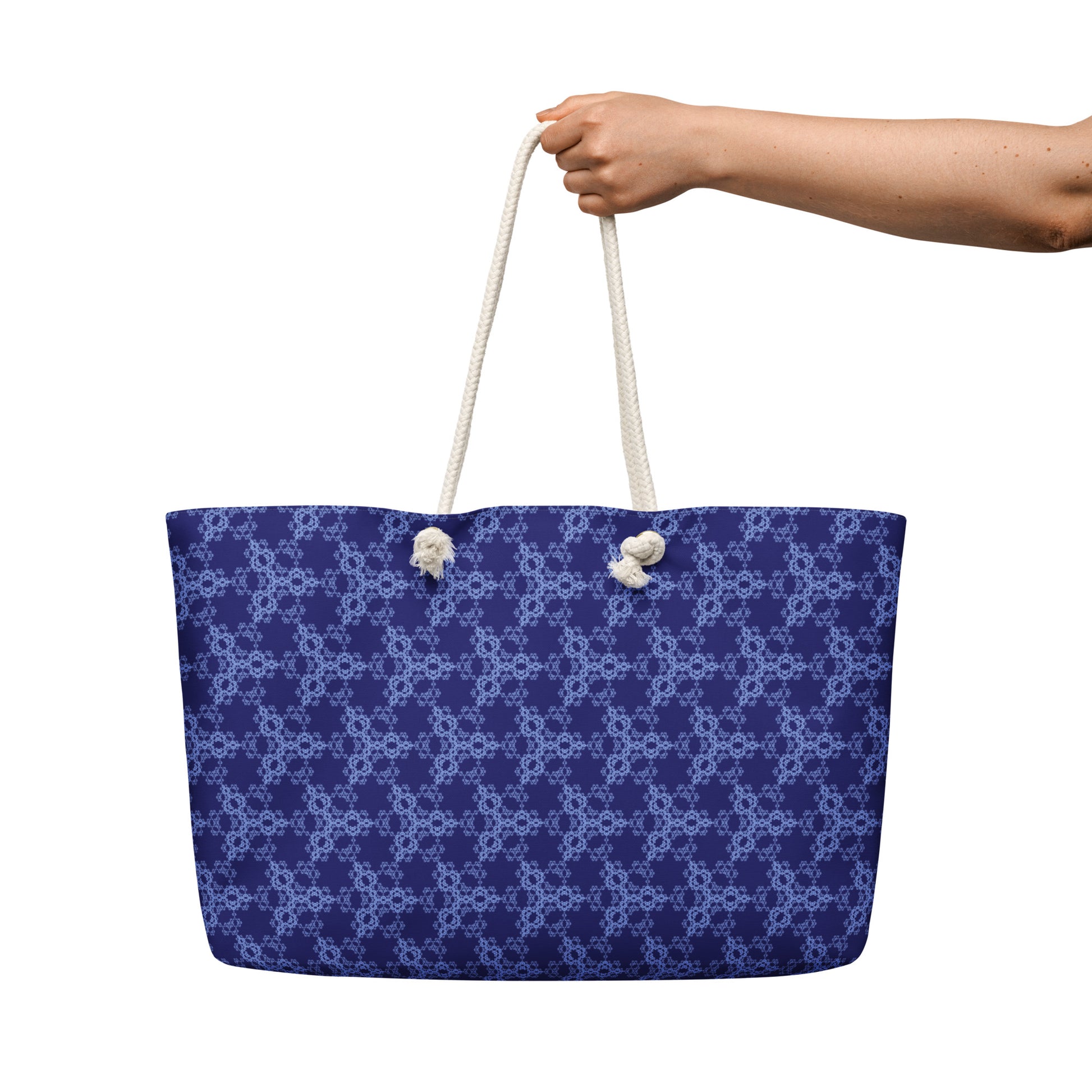 Oversized weekender bag with the 'Triagon' navy and blue fractal geometric pattern.