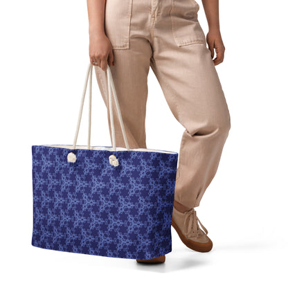 Oversized weekender bag with the 'Triagon' navy and blue fractal geometric pattern.