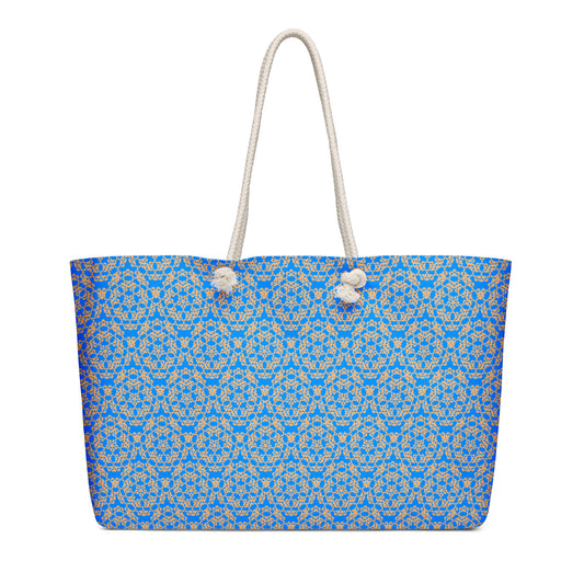 Oversized weekender bag with the 'Pentagon' blue and yellow fractal geometric pattern.