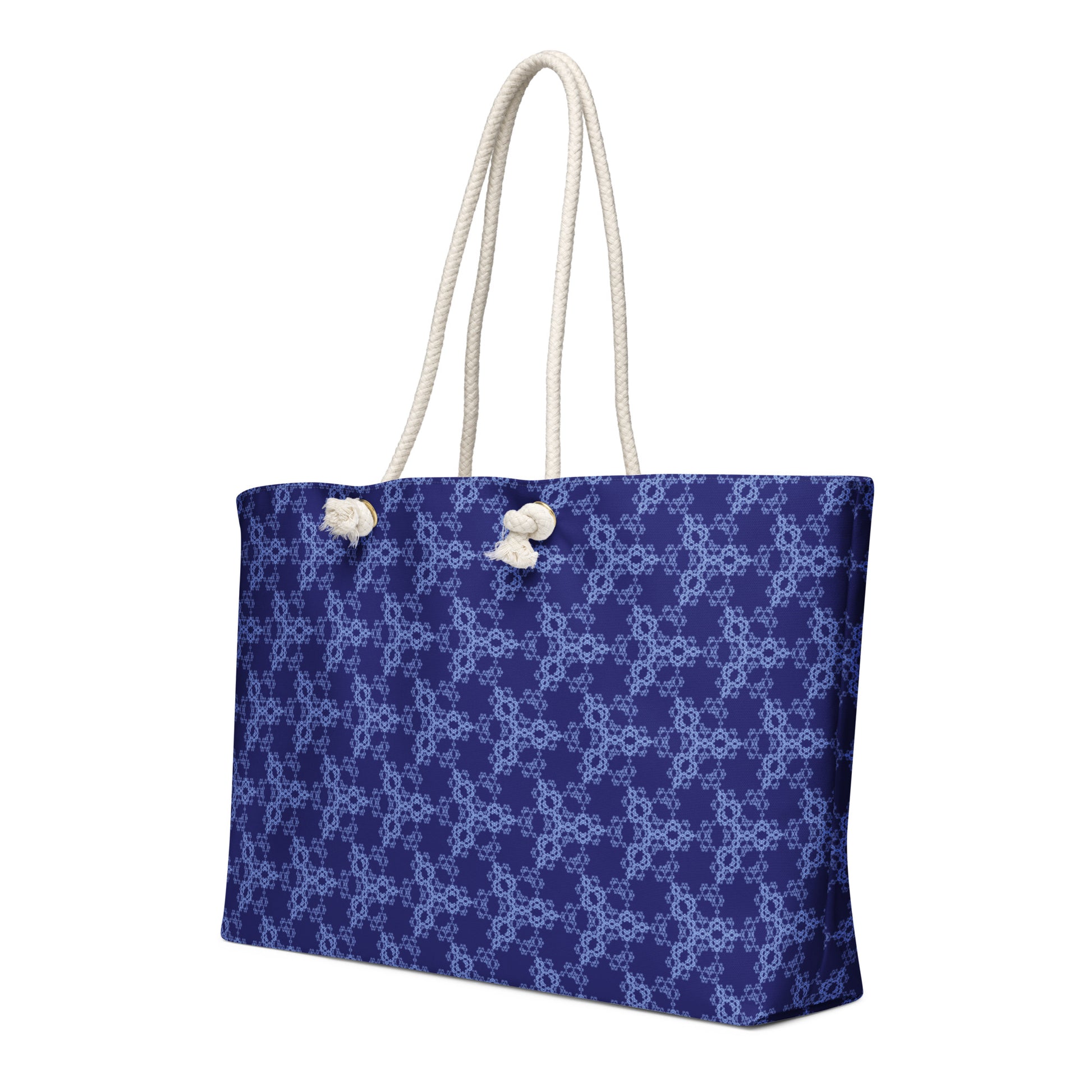 Oversized weekender bag with the 'Triagon' navy and blue fractal geometric pattern.