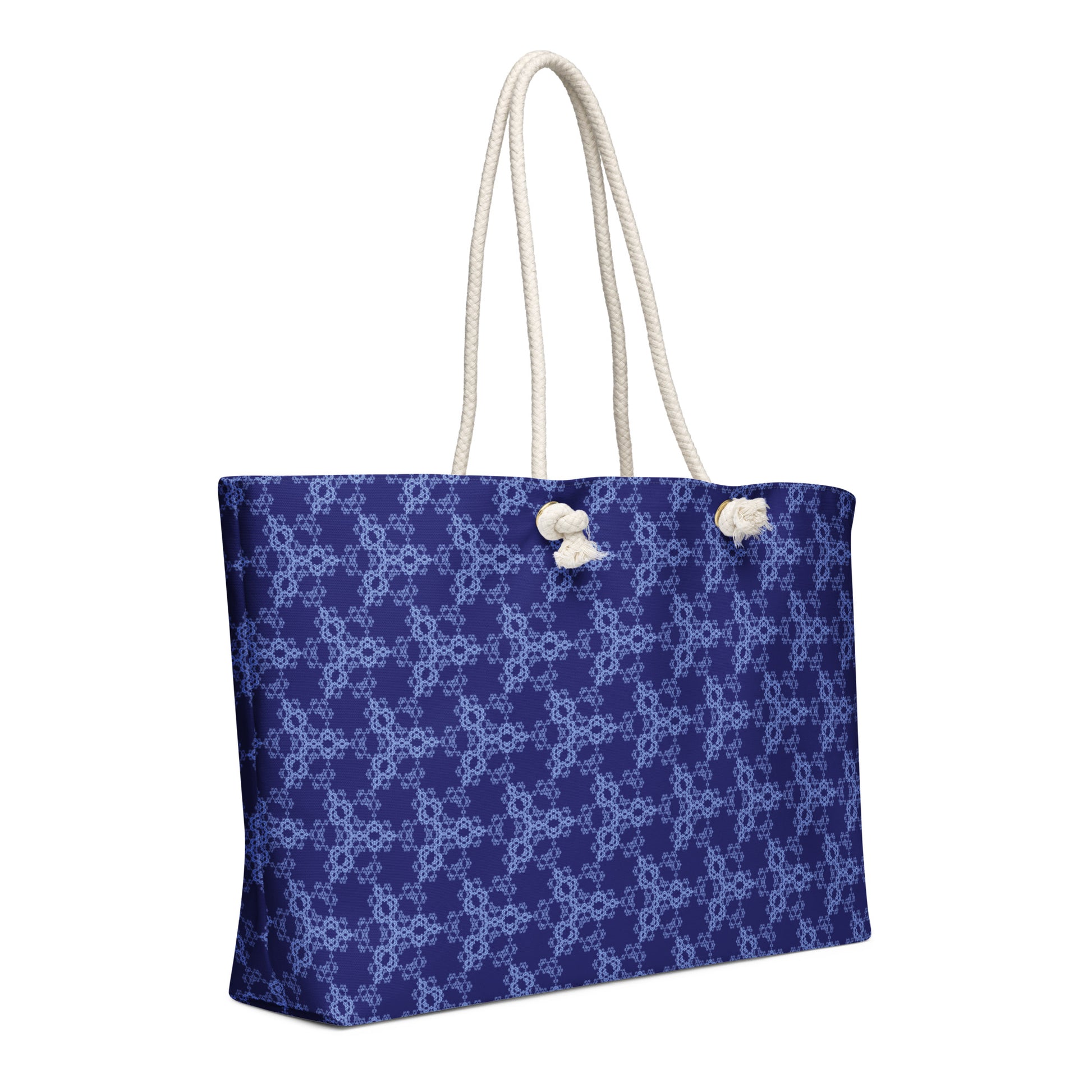 Oversized weekender bag with the 'Triagon' navy and blue fractal geometric pattern.