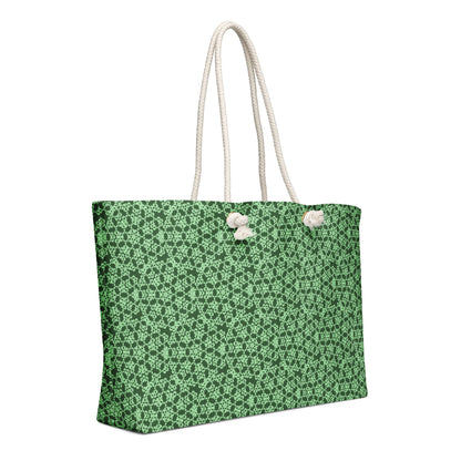 Left angle shot of the oversized weekender bag with the 'Heptagon' green fractal geometric pattern.