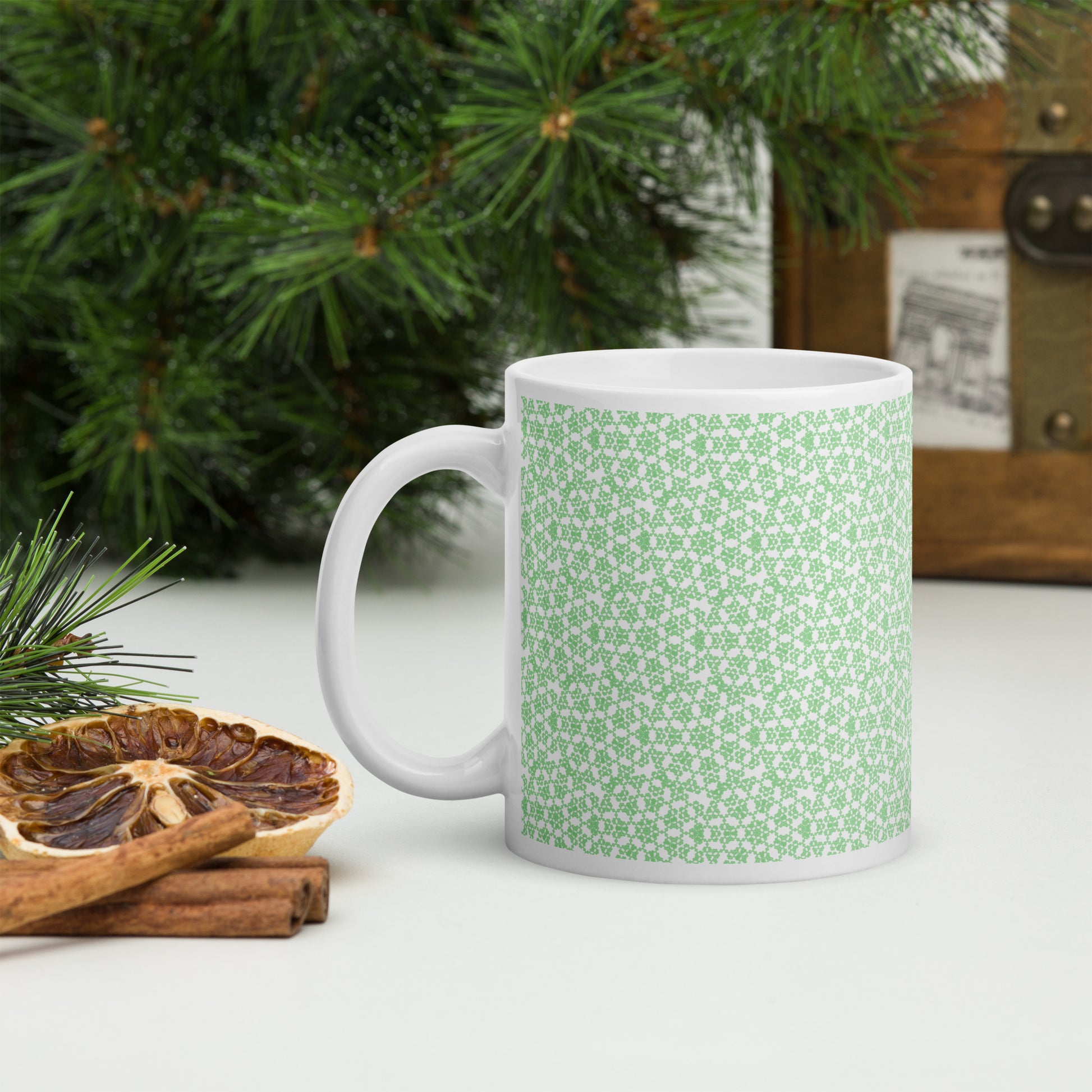 11 oz white glossy mug with the 'Heptagon' green fractal geometric pattern.