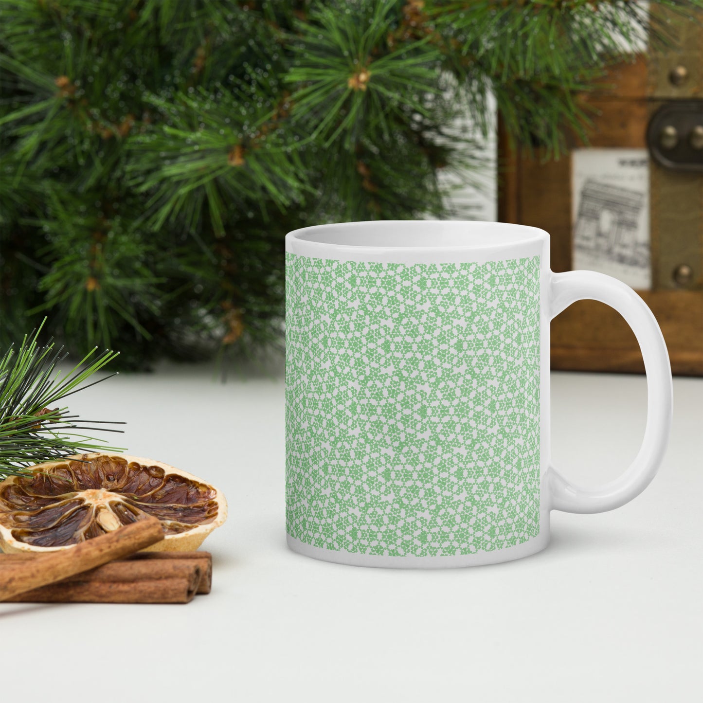 11 oz white glossy mug with the 'Heptagon' green fractal geometric pattern.