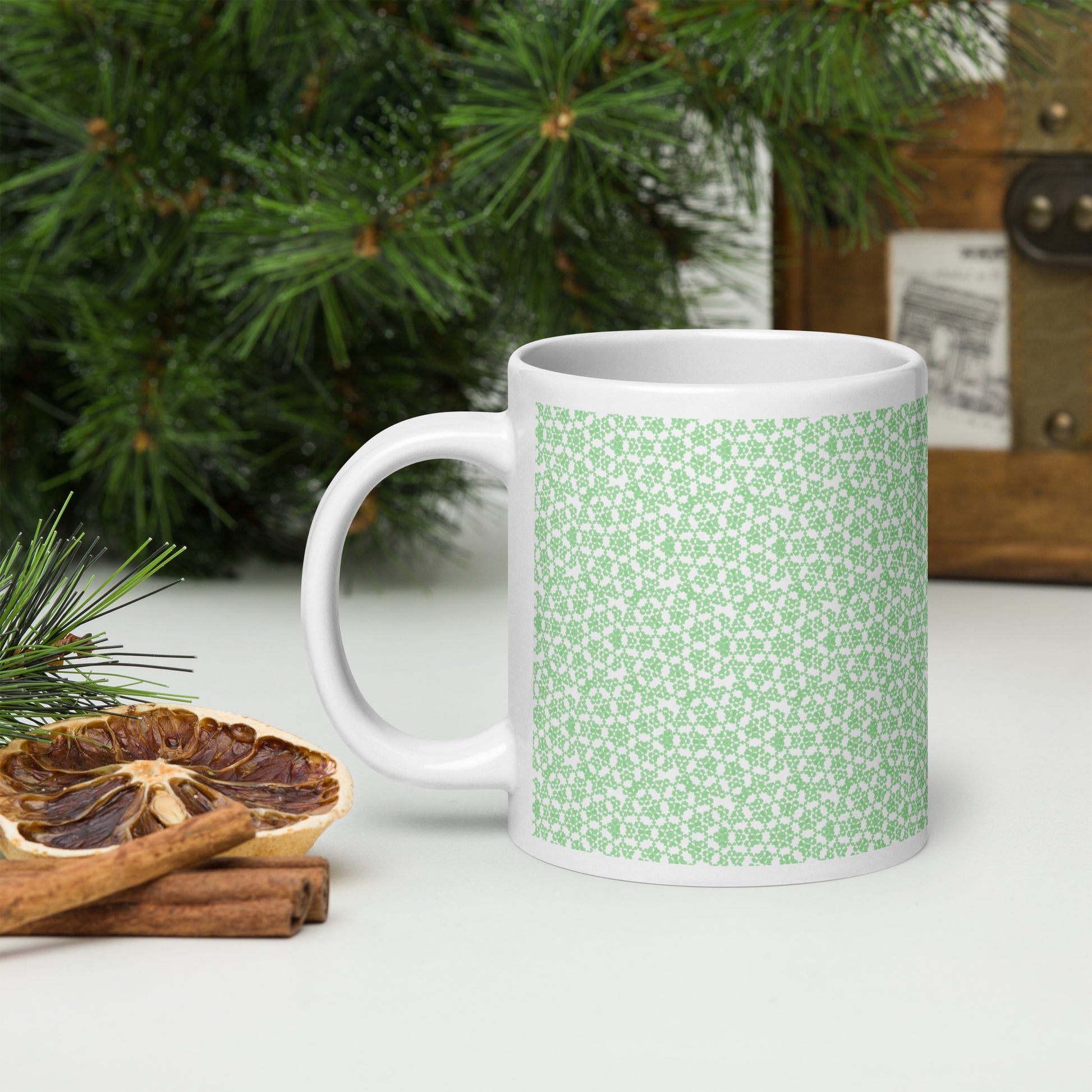 20 oz white glossy mug with the 'Heptagon' green fractal geometric pattern.