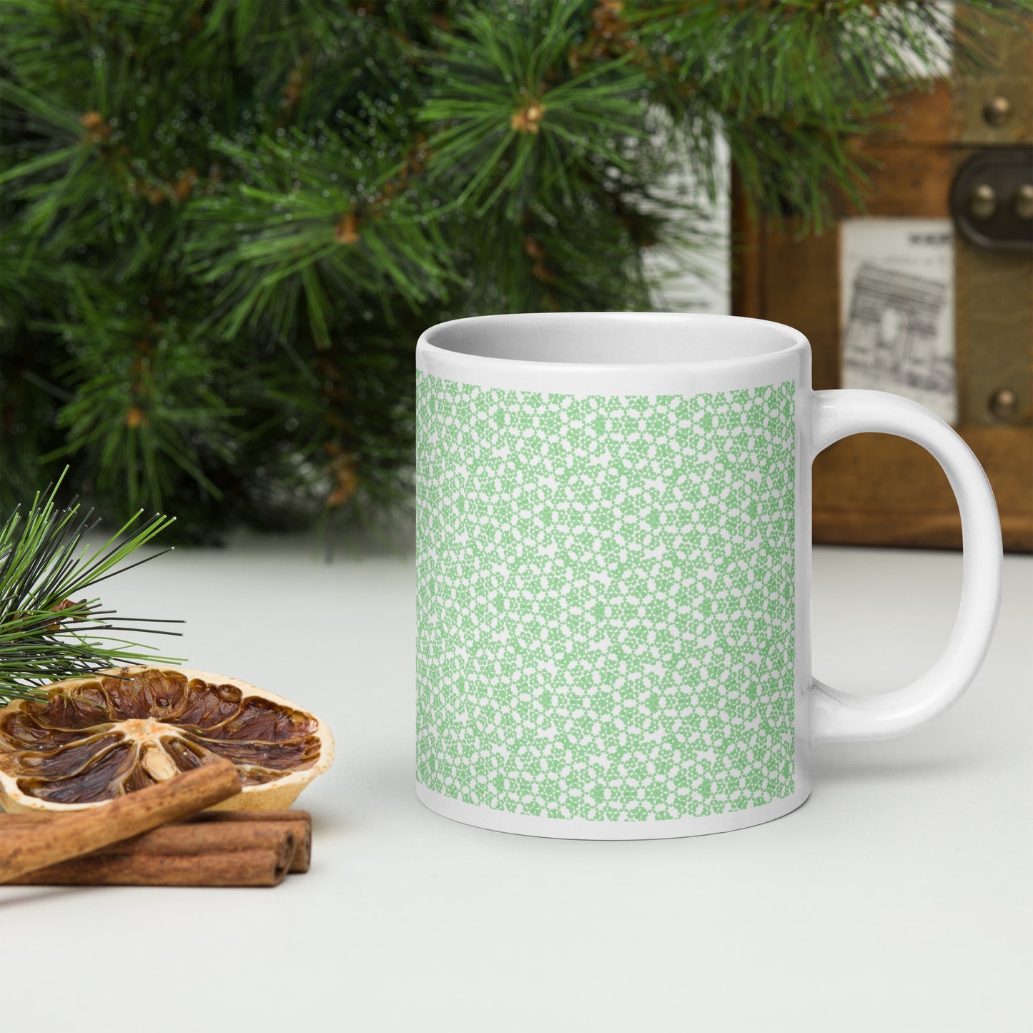 20 oz white glossy mug with the 'Heptagon' green fractal geometric pattern.